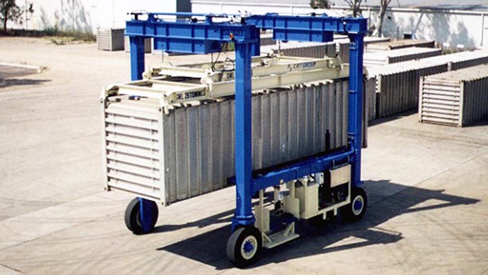 Isoloader Econolifter Straddle Carrier handling containers in a small distribution center