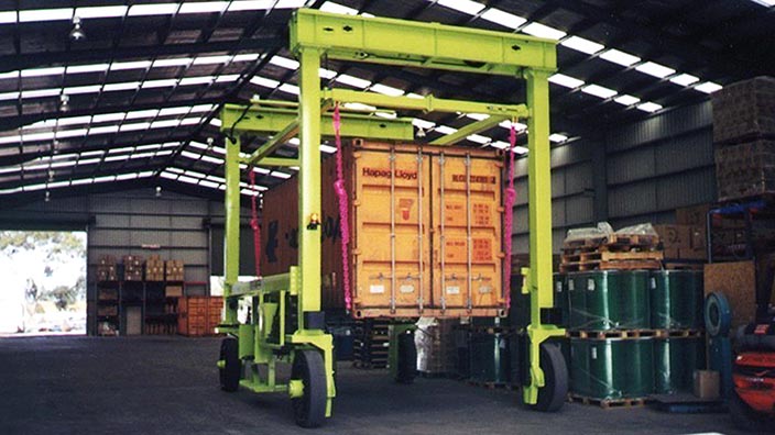 Isoloader Econolifter Straddle Carrier with telescoping masts for low height clearances
