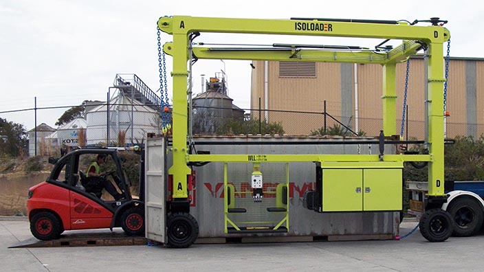 Isoloader EZLift Mini Straddle Carrier unloads containers from trucks to allow unpacking at ground level with a forklift